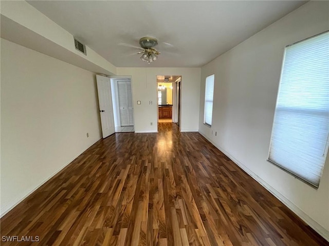 4703 SE 17th Pl Unit 105, Cape Coral, FL 33904 - spare room featuring dark wood-style floors, ceiling fan, and baseboards