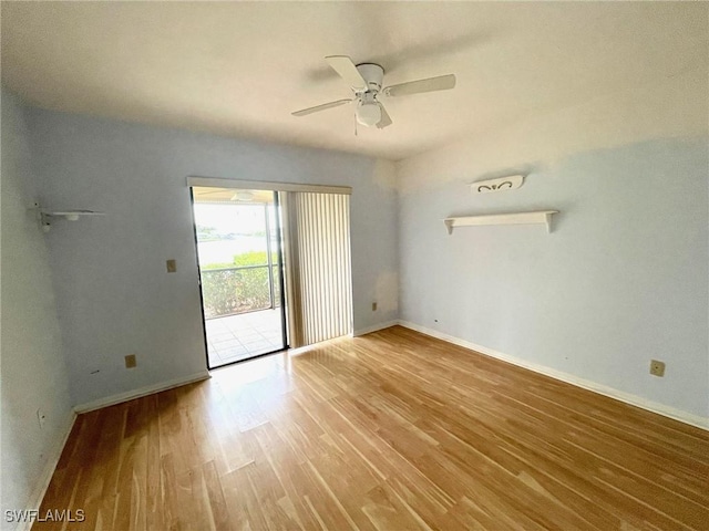4703 SE 17th Pl Unit 105, Cape Coral, FL 33904 - empty room with wood finished floors, a ceiling fan, and baseboards