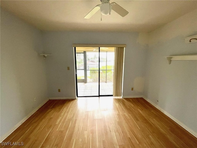 4703 SE 17th Pl Unit 105, Cape Coral, FL 33904 - spare room featuring wood finished floors, baseboards, and a ceiling fan