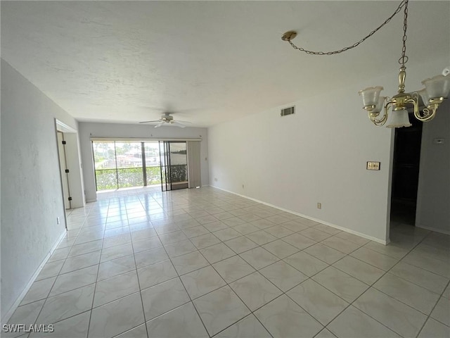 4703 SE 17th Pl Unit 105, Cape Coral, FL 33904 - unfurnished room with a chandelier, light tile patterned floors, ceiling fan, and baseboards