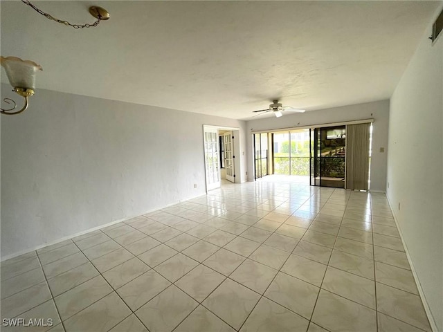4703 SE 17th Pl Unit 105, Cape Coral, FL 33904 - empty room with light tile patterned floors and a ceiling fan