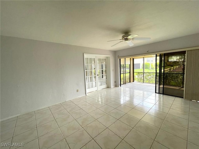 4703 SE 17th Pl Unit 105, Cape Coral, FL 33904 - empty room with ceiling fan, french doors, and light tile patterned floors