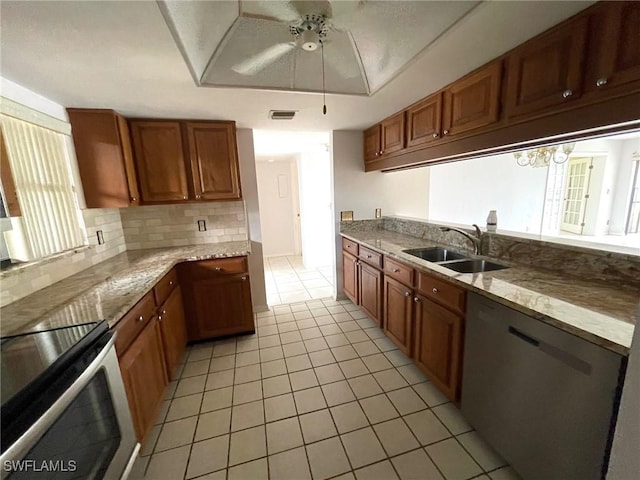 4703 SE 17th Pl Unit 105, Cape Coral, FL 33904 - kitchen with a sink, stainless steel appliances, light tile patterned floors, tasteful backsplash, and ceiling fan