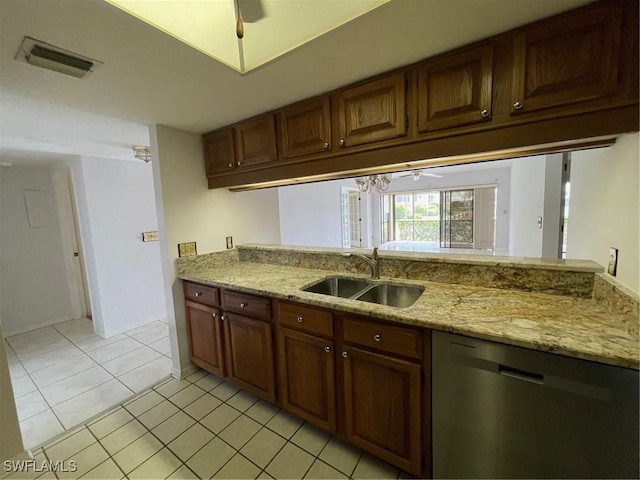 4703 SE 17th Pl Unit 105, Cape Coral, FL 33904 - kitchen with dishwasher, a sink, light stone counters, and light tile patterned flooring