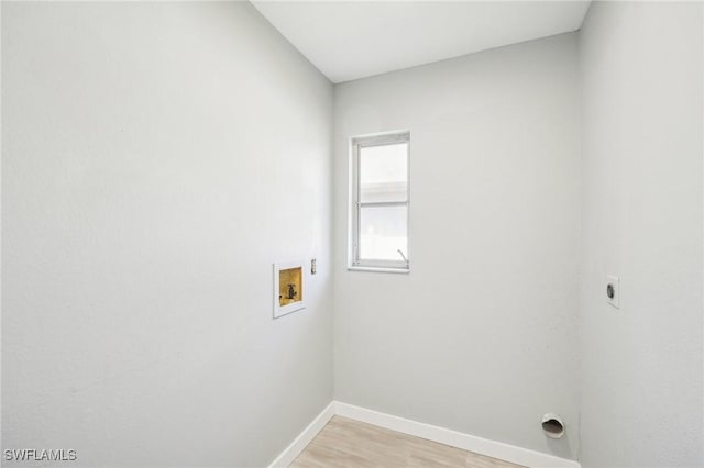 washroom featuring light wood finished floors, baseboards, washer hookup, laundry area, and hookup for an electric dryer