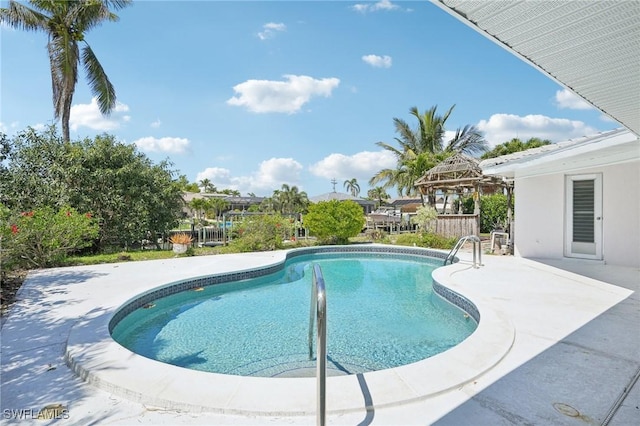 outdoor pool featuring a patio