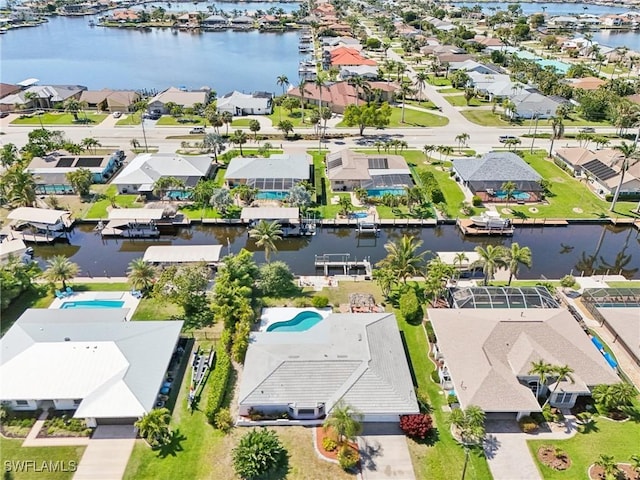 aerial view with a residential view and a water view