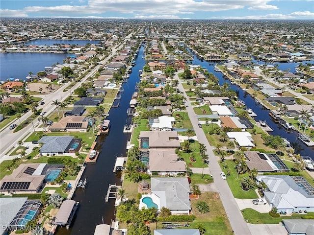 birds eye view of property with a residential view and a water view