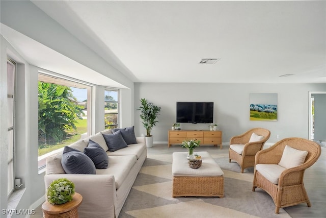 5208 SW 3rd Ave, Cape Coral, FL 33914 - living area featuring plenty of natural light and baseboards