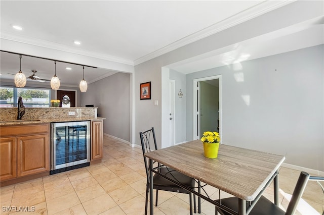 944 22nd Ave N, Naples, FL 34103 - dining area with crown molding, recessed lighting, beverage cooler, and baseboards