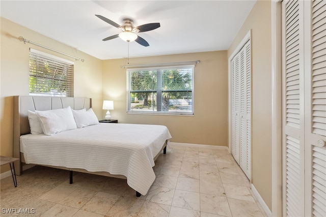 944 22nd Ave N, Naples, FL 34103 - bedroom with marble finish floor, baseboards, and ceiling fan