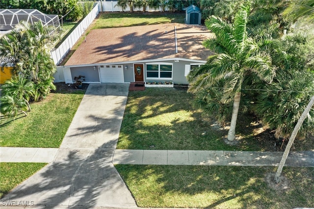 944 22nd Ave N, Naples, FL 34103 - view of front of property with an outbuilding, driveway, a front lawn, fence, and a garage