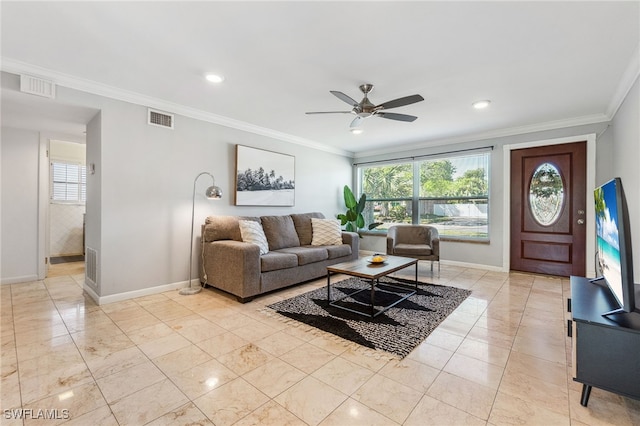 944 22nd Ave N, Naples, FL 34103 - living area featuring visible vents, baseboards, a ceiling fan, and crown molding