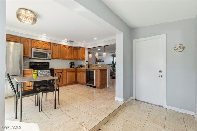 944 22nd Ave N, Naples, FL 34103 - kitchen featuring brown cabinets, beverage cooler, stainless steel appliances, a peninsula, and crown molding