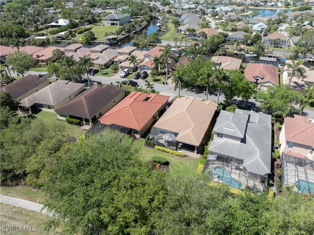 birds eye view of property with a residential view