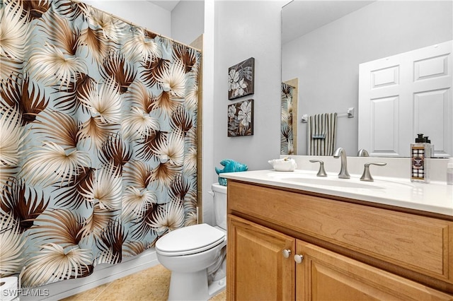 bathroom with tile patterned floors, a shower with shower curtain, toilet, and vanity