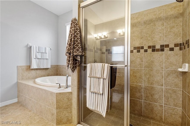 full bathroom with tile patterned floors, a garden tub, and a stall shower