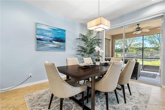 dining space with light tile patterned floors and baseboards