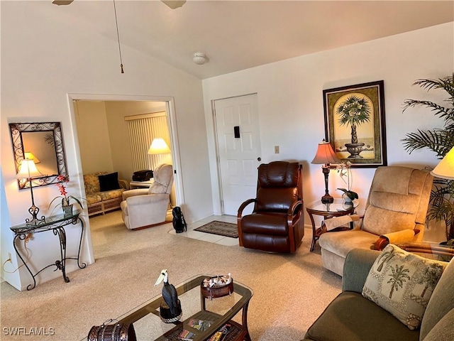 carpeted living room featuring lofted ceiling and ceiling fan