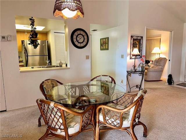 dining space with carpet flooring and visible vents