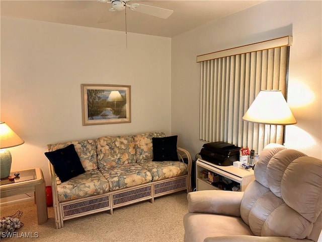 carpeted living room featuring ceiling fan