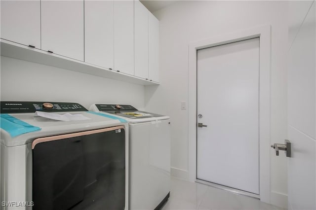 laundry room with cabinet space and washing machine and dryer