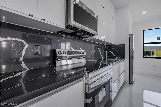 kitchen with white cabinets, modern cabinets, and appliances with stainless steel finishes