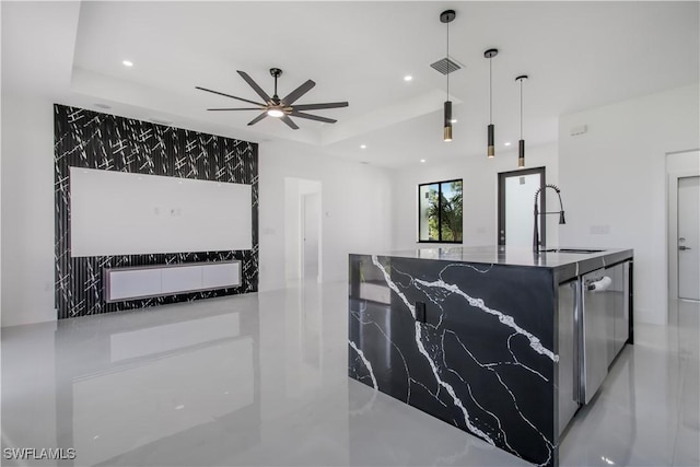 kitchen featuring visible vents, a ceiling fan, a sink, recessed lighting, and a raised ceiling