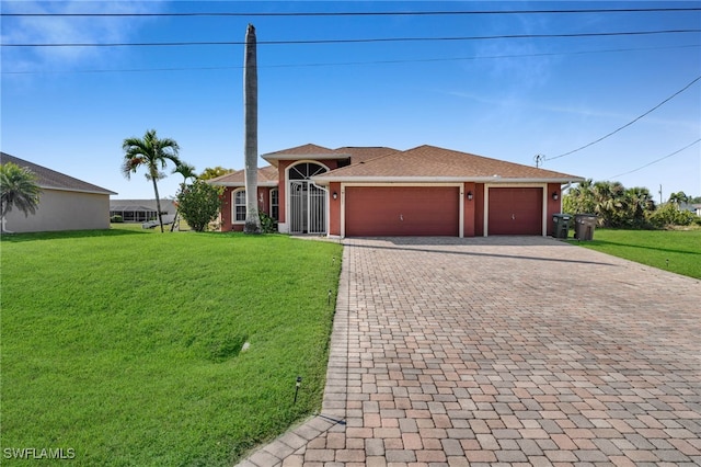 view of front of house with decorative driveway, a front lawn, and an attached garage