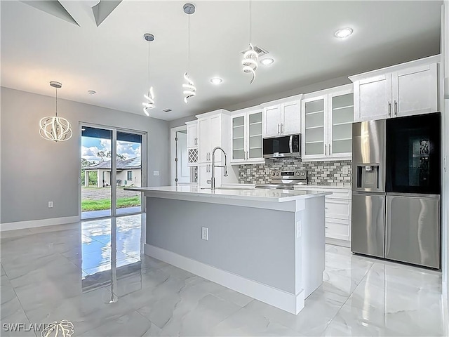 650 Kraft St, Lehigh Acres, FL 33974 - kitchen featuring stainless steel appliances, light marble finish flooring, a sink, baseboards, and light countertops