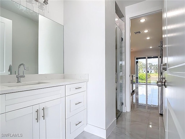650 Kraft St, Lehigh Acres, FL 33974 - bathroom featuring vanity, recessed lighting, marble finish flooring, and baseboards