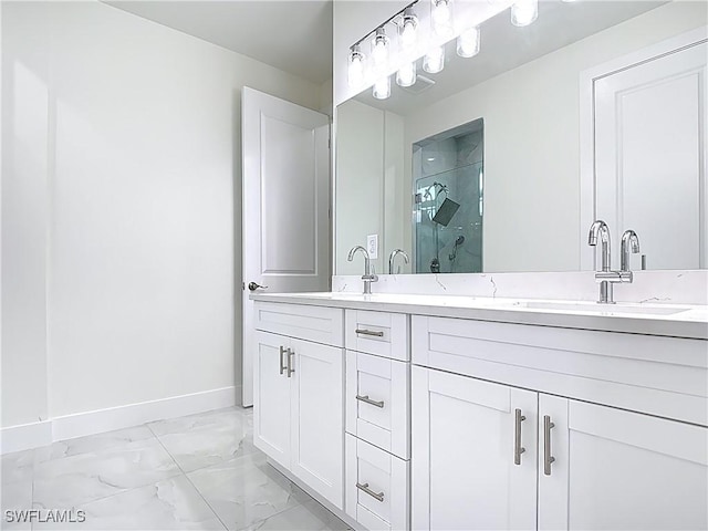 650 Kraft St, Lehigh Acres, FL 33974 - bathroom with marble look tile flooring, baseboards, a stall shower, and double vanity