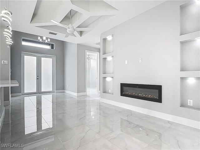 650 Kraft St, Lehigh Acres, FL 33974 - unfurnished living room with marble tiled floors, baseboards, a glass covered fireplace, a ceiling fan, and french doors