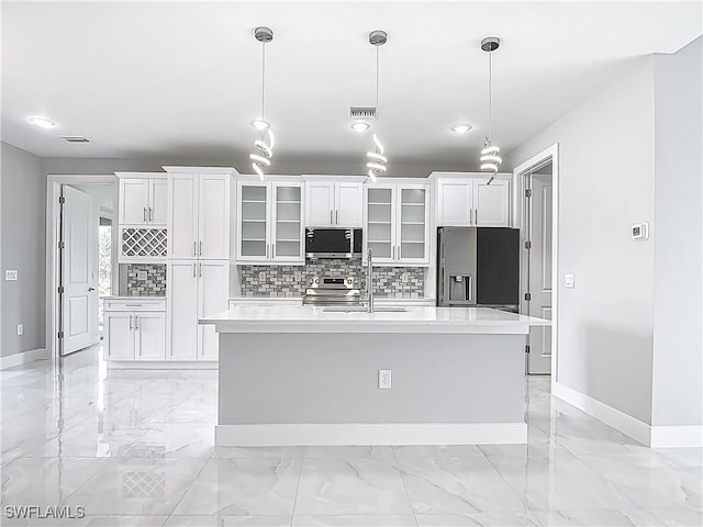650 Kraft St, Lehigh Acres, FL 33974 - kitchen with stainless steel appliances, baseboards, light marble finish floors, white cabinetry, and recessed lighting