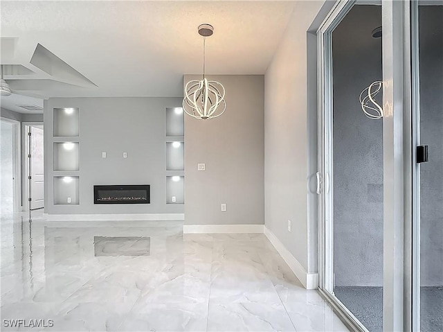 650 Kraft St, Lehigh Acres, FL 33974 - unfurnished living room featuring marble finish flooring, a chandelier, built in shelves, a glass covered fireplace, and baseboards