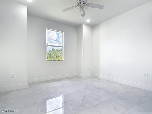 650 Kraft St, Lehigh Acres, FL 33974 - spare room featuring light marble finish floors, baseboards, a ceiling fan, and recessed lighting