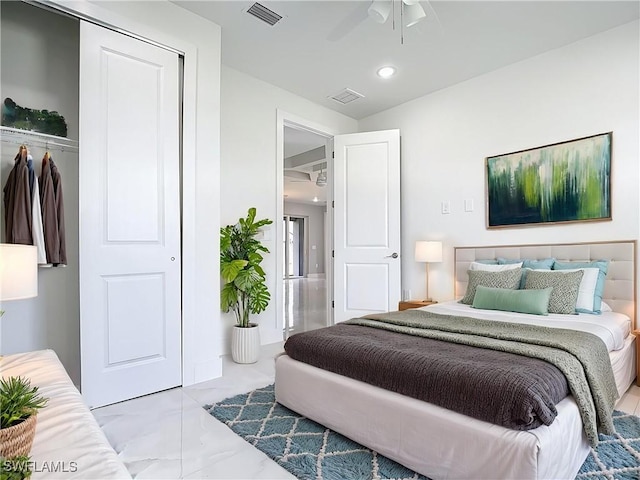 650 Kraft St, Lehigh Acres, FL 33974 - bedroom featuring marble look tiles, recessed lighting, a ceiling fan, and a closet
