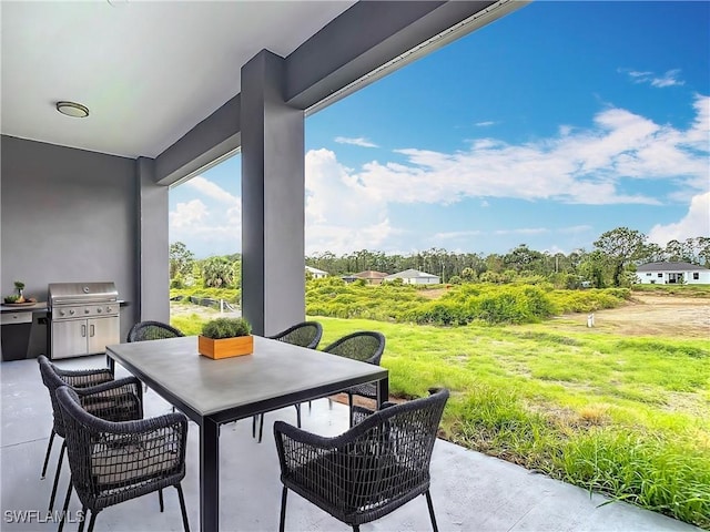 650 Kraft St, Lehigh Acres, FL 33974 - view of patio with outdoor dining area and a grill