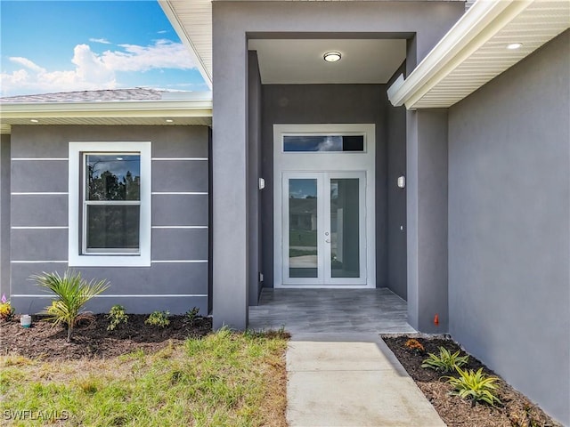 650 Kraft St, Lehigh Acres, FL 33974 - entrance to property featuring french doors and stucco siding