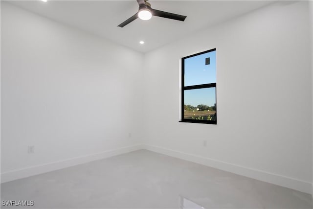 unfurnished room with recessed lighting, finished concrete floors, ceiling fan, and baseboards