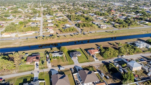 birds eye view of property featuring a residential view and a water view