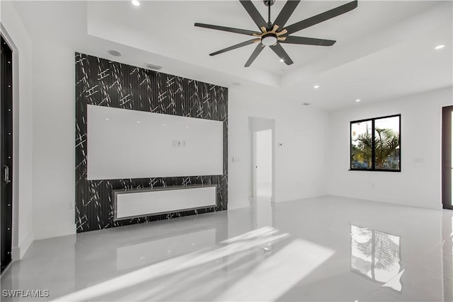 empty room featuring recessed lighting, a tray ceiling, visible vents, and a ceiling fan