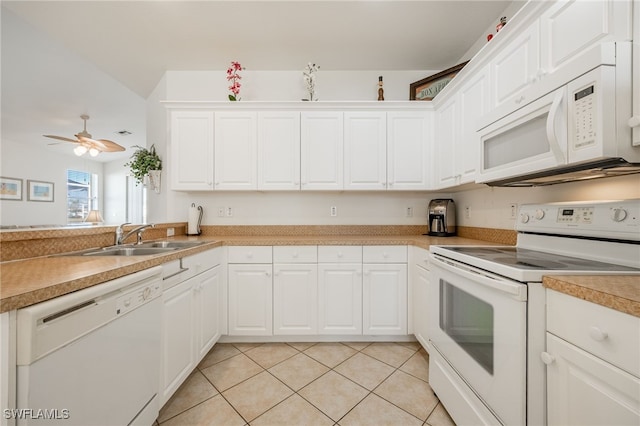 kitchen featuring white cabinetry, white appliances, light tile patterned floors, and a sink