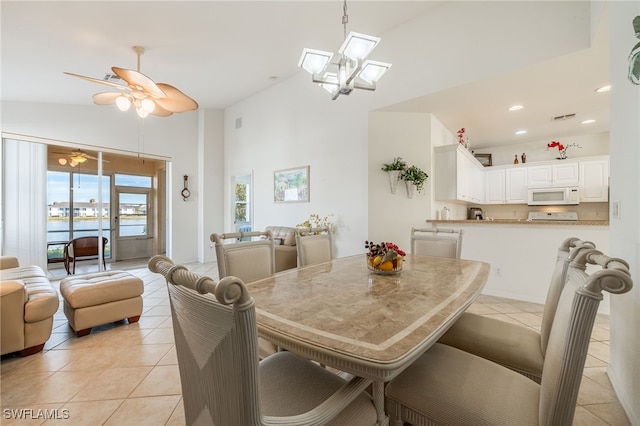 dining area with visible vents, ceiling fan, recessed lighting, light tile patterned flooring, and high vaulted ceiling