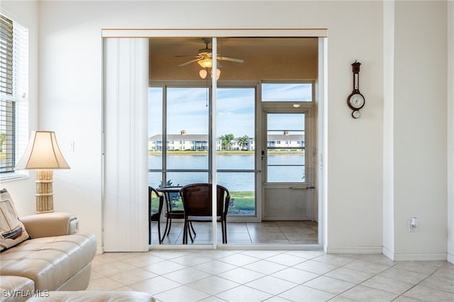 interior space featuring a water view and ceiling fan