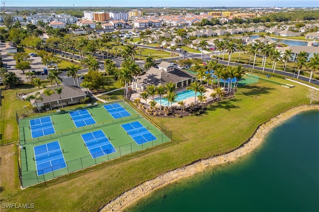 drone / aerial view with a residential view and a water view