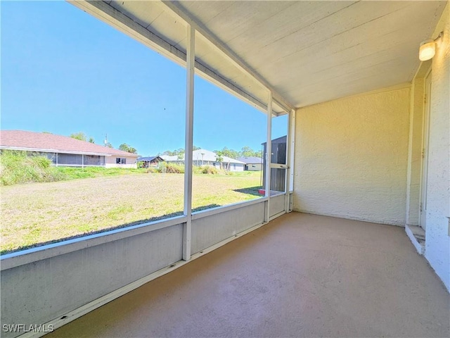 unfurnished sunroom with a residential view