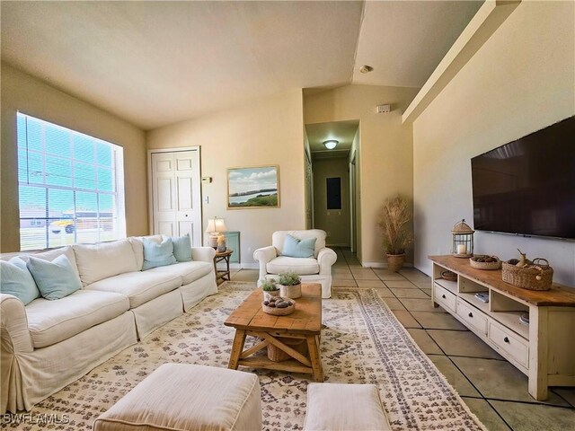 5012-5014 Leonard Blvd S, Lehigh Acres, FL 33973 - living area with vaulted ceiling and light tile patterned floors