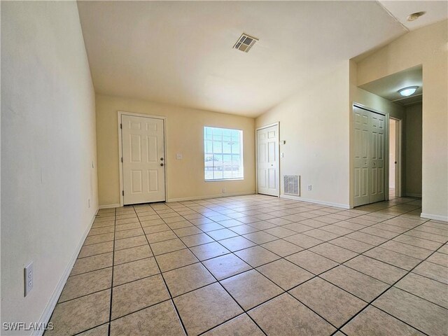 5012-5014 Leonard Blvd S, Lehigh Acres, FL 33973 - spare room featuring light tile patterned floors and baseboards