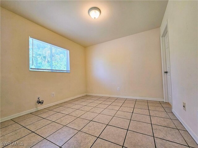 5012-5014 Leonard Blvd S, Lehigh Acres, FL 33973 - unfurnished room featuring light tile patterned floors and baseboards